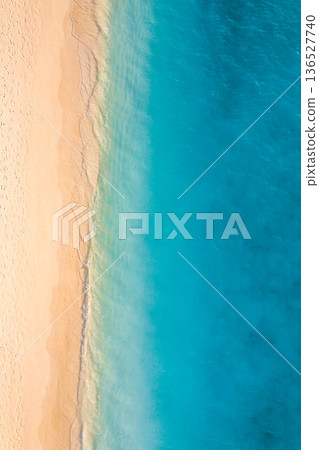 Drone view aerial beach pristine ocean blue waves tropical coastline landscape Drone view aerial beach pristine ocean blue waves tropical coastline landscape 136527740