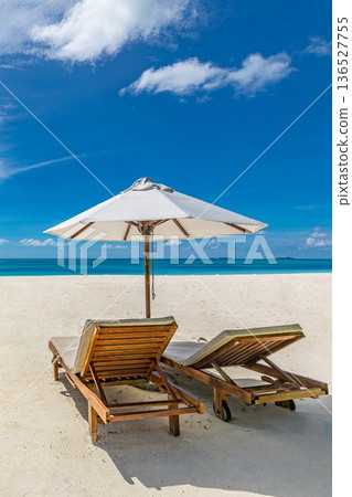 Sunny beach couple travel destination scenic ocean view minimal background resort 136527755
