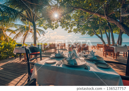 Exotic hotel resort dining peaceful sunset outdoors restaurant tropical island Exotic hotel resort dining peaceful sunset outdoors restaurant tropical island 136527757