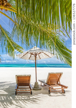Tropical ocean view beach chairs palm leaves landscape Maldives resort vacation Tropical ocean view beach chairs palm leaves landscape Maldives resort vacation 136527776