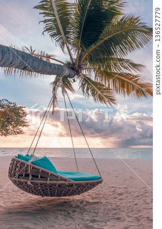 Tranquil sunset beach travel landscape palm tree swing hammock nature ocean view 136527779