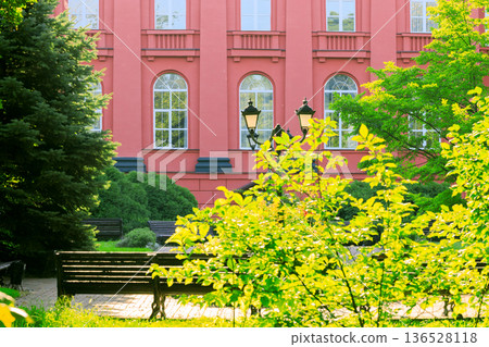 bright sunny day park outdoor and university campus red wall building idyllic place in summer 136528118