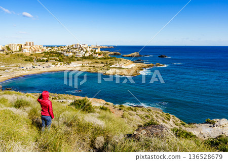 Tourist woman on sea coast in Spain Tourist woman on sea coast in Spain 136528679