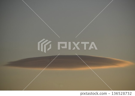 The beautifully colored sunset clouds change shape every moment The beautifully colored sunset clouds change shape every moment 136528732