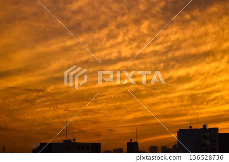 The beautifully colored sunset clouds change shape every moment 136528736