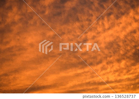 The beautifully colored sunset clouds change shape every moment 136528737