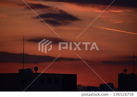The beautifully colored sunset clouds change shape every moment The beautifully colored sunset clouds change shape every moment 136528756