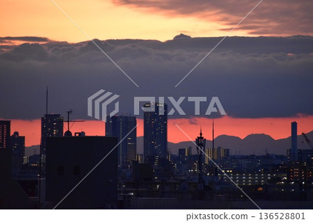 The beautifully colored sunset clouds change shape every moment 136528801