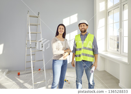 Foreman and female apartment owner discussing future apartment design Foreman and female apartment owner discussing future apartment design 136528833