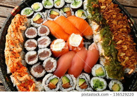 Assorted Sushi Platter on Elegant Plate Assorted Sushi Platter on Elegant Plate 136529220