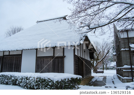 Snow scene on the thatched roof Snow scene on the thatched roof 136529316