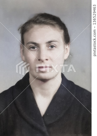Vintage portrait of a serious young woman. Retro photo, 1962. 136529463