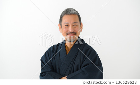 A man wearing a kimono 136529628