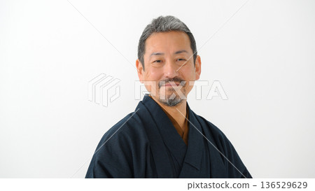A man wearing a kimono 136529629