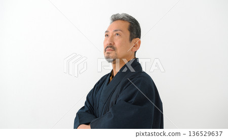 A man wearing a kimono A man wearing a kimono 136529637