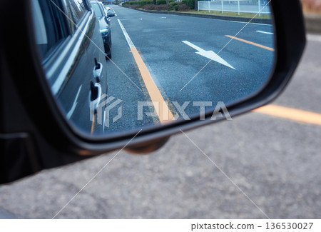 Road lines and cars seen from a car's reflective mirror Road lines and cars seen from a car's reflective mirror 136530027