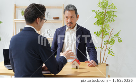 Men negotiating business Men negotiating business 136530326