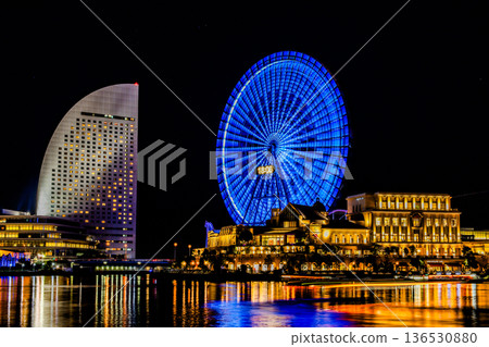 Ferris wheel reflected on the water surface Ferris wheel reflected on the water surface 136530880