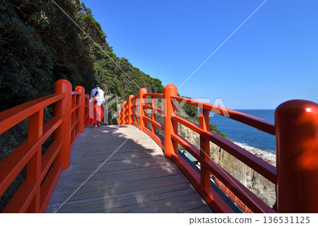 Udo Shrine, a shrine maiden crossing the Tamabashi Bridge, Nichinan City, Miyazaki Prefecture 136531125