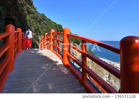 Udo Shrine, a shrine maiden crossing the Tamabashi Bridge, Nichinan City, Miyazaki Prefecture Udo Shrine, a shrine maiden crossing the Tamabashi Bridge, Nichinan City, Miyazaki Prefecture 136531126