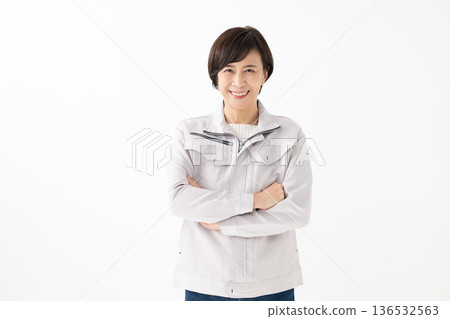 Woman dressed in work clothes Woman dressed in work clothes 136532563
