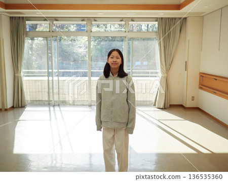 A female junior high school student in a winter karate class A female junior high school student in a winter karate class 136535360