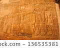 Exquisite reliefs of gods and pharaohs at Luxor Temple 136535381