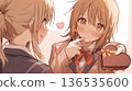 Valentine's Day image of two high school girls giving each other heart-shaped chocolates 136535600