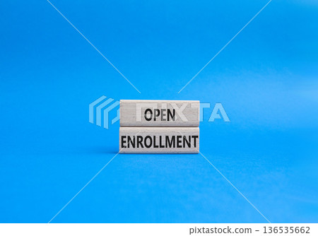 Open Enrollment symbol. Wooden blocks with words Open Enrollment. Beautiful blue background. Business and Open Enrollment concept. Copy space. Open Enrollment symbol. Wooden blocks with words Open Enrollment. Beautiful blue background. Business and Open Enrollment concept. Copy space. 136535662