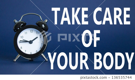 Health symbol. Wooden blocks with words Take Care of your Body. Beautiful deep blue background with alarm clock. Health concept. Copy space. Health symbol. Wooden blocks with words Take Care of your Body. Beautiful deep blue background with alarm clock. Health concept. Copy space. 136535744