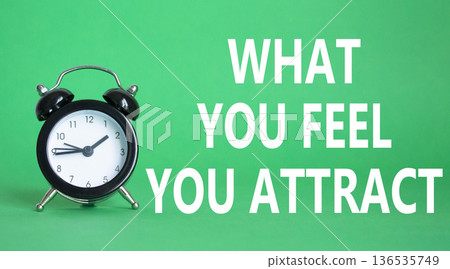 What you Feel you Attract you symbol. Wooden blocks with words What you Feel you Attract. Beautiful green background with alarm clock. Business and What you Feel you Attract concept. Copy space. 136535749
