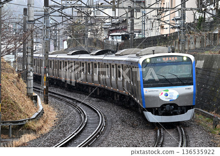 Sotetsu 11000 series train running through falling snow Sotetsu 11000 series train running through falling snow 136535922