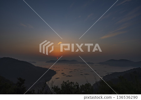 Beautiful sunrise seen from the sea at Mushiake, Setouchi City, Okayama Prefecture, Japan Beautiful sunrise seen from the sea at Mushiake, Setouchi City, Okayama Prefecture, Japan 136536290