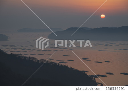 Beautiful sunrise seen from the sea at Mushiake, Setouchi City, Okayama Prefecture, Japan Beautiful sunrise seen from the sea at Mushiake, Setouchi City, Okayama Prefecture, Japan 136536291