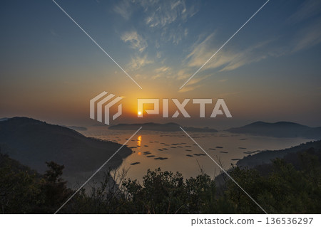 Beautiful sunrise seen from the sea at Mushiake, Setouchi City, Okayama Prefecture, Japan Beautiful sunrise seen from the sea at Mushiake, Setouchi City, Okayama Prefecture, Japan 136536297