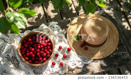 Cranberries with Straw Hat on Rustic Wooden Table 136536455