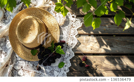 Mulberries with Straw Hat on Rustic Wooden Table Mulberries with Straw Hat on Rustic Wooden Table 136536479