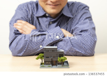 Man looking at house Man looking at house 136537455