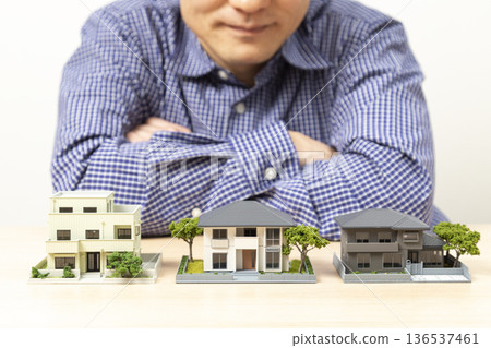 Man looking at house 136537461