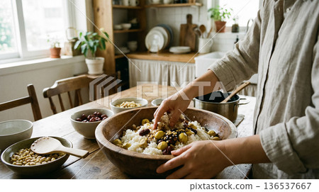 Hands Mixing Korean Yakbap Ingredients in Wooden Bowl Traditional Cooking Scene Hands Mixing Korean Yakbap Ingredients in Wooden Bowl Traditional Cooking Scene 136537667