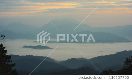 sunrise with moving of cloud and clear sky and layer of mountain 136537700
