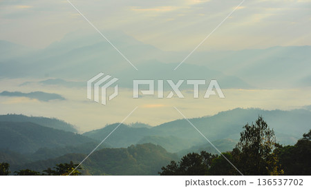 sunrise with moving of cloud and clear sky and layer of mountain sunrise with moving of cloud and clear sky and layer of mountain 136537702