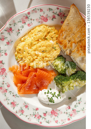 Breakfast plate with scrambled eggs salmon and bread Breakfast plate with scrambled eggs salmon and bread 136539230