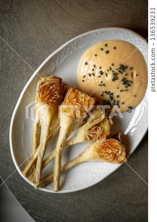 Crispy fried artichokes with creamy dipping sauce Crispy fried artichokes with creamy dipping sauce 136539231