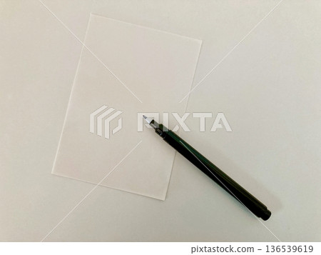 pen and a piece of paper pen and a piece of paper 136539619