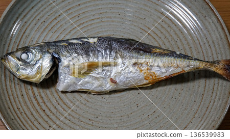 A whole fragrant grilled horse mackerel served on a ceramic plate A whole fragrant grilled horse mackerel served on a ceramic plate 136539983