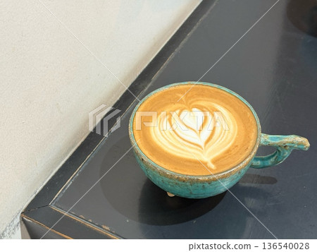 Latte art and turquoise cups on the table Latte art and turquoise cups on the table 136540028