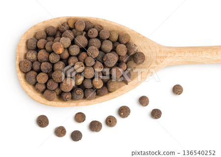 Allspice pepper in wooden spoon isolated on white background. Jamaica pepper, Pimenta dioica or myrtle pepper. Top view Allspice pepper in wooden spoon isolated on white background. Jamaica pepper, Pimenta dioica or myrtle pepper. Top view 136540252