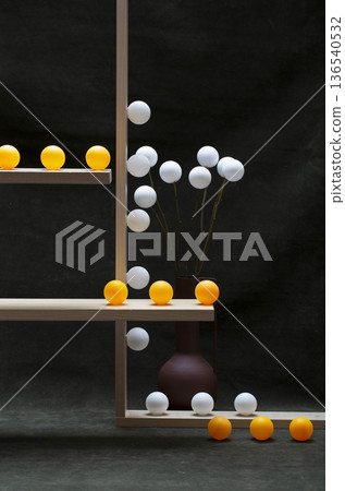 Still life with white vases and white and orange balls on wooden shelves Still life with white vases and white and orange balls on wooden shelves 136540532