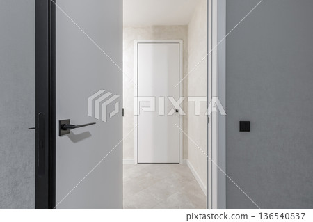 Modern Interior View Through Open Door to Hallway 136540837